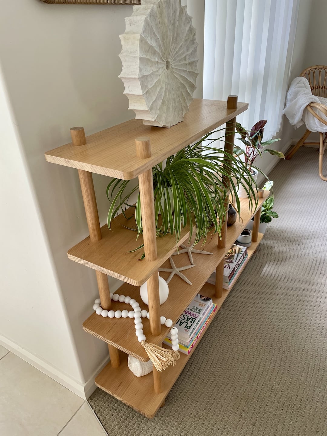 Side view of the Tasmanian Oak bookshelf in the clients home with decoration