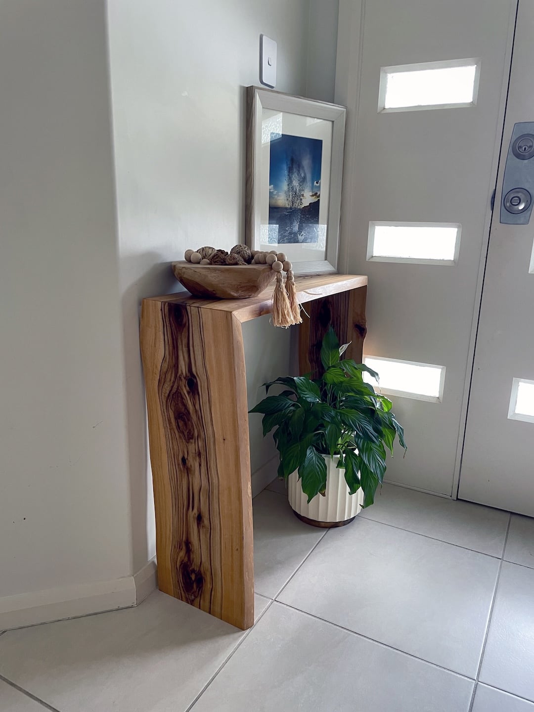 custom-console-table-view-3 side side of the custom made entry console table showing the wood grain beautiful waterfall legs