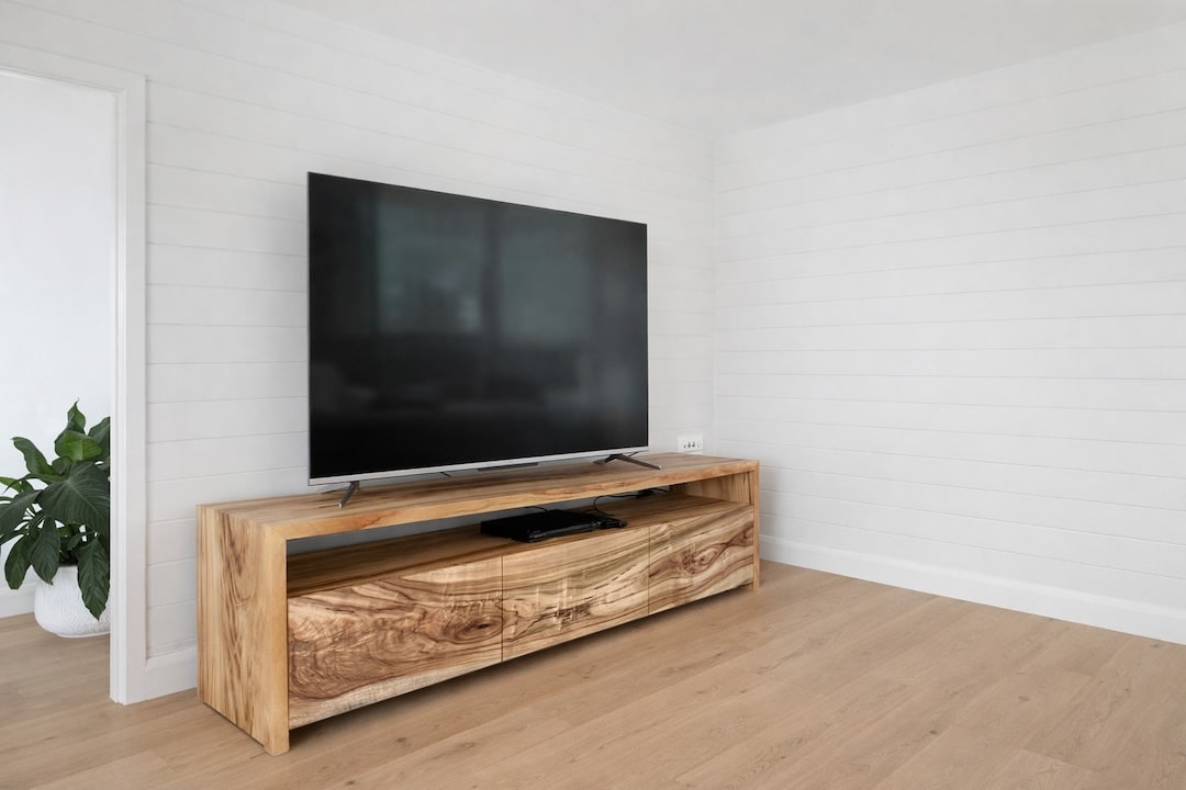 Side view of the tv cabinet showcasing the waterfall legs and continues flowing wood grain