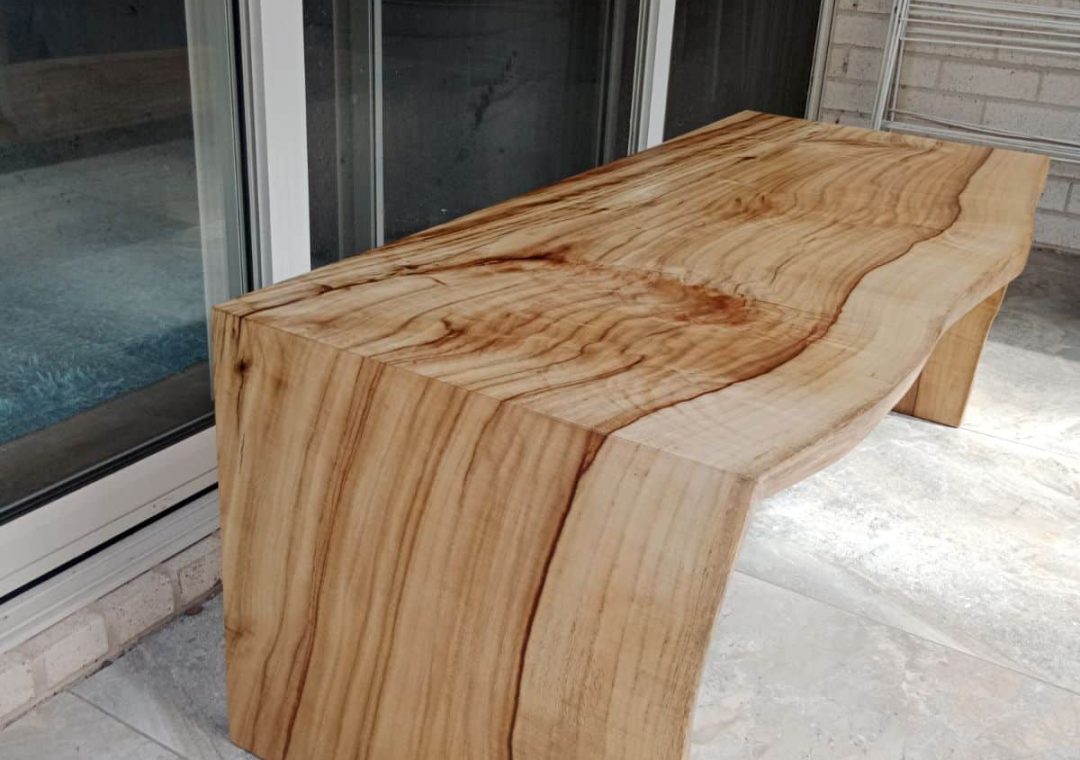 custon-built-pool-bench-view-1 Outdoor custom made bench with waterfall legs showing bright vibrant colours of the woo grain