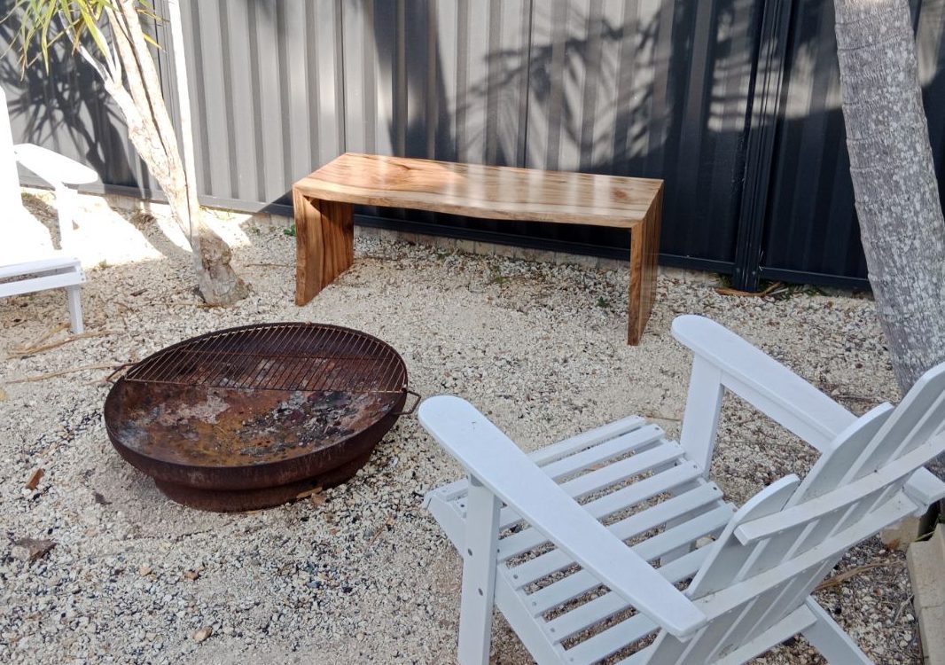 custon-built-pool-bench-view-4 Outdoor bench in client back yard fire pit area