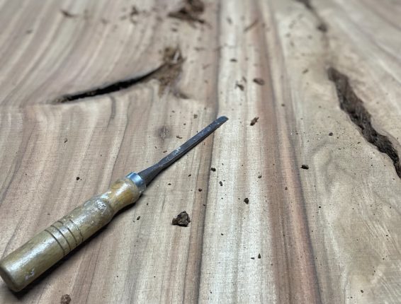 handmade-custom-live-edge-dining-table-make-2 Time slab clean up with a chisel