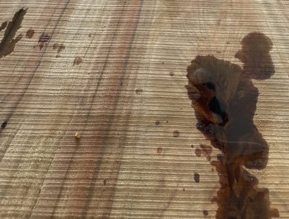 handmade-custom-live-edge-dining-table-make-6 Timber slab for a dining table wit voids filled with black resin